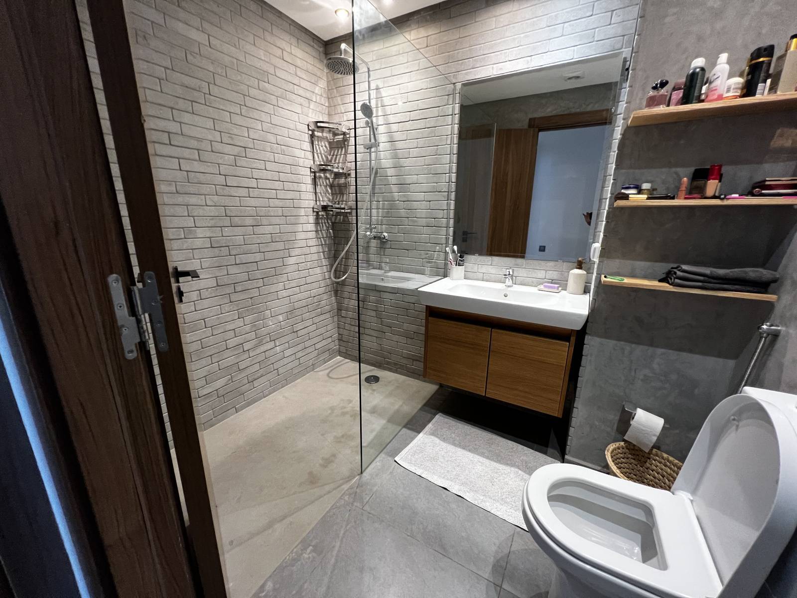 Walk-in shower tray and gray natural stone brick wall in Casablanca