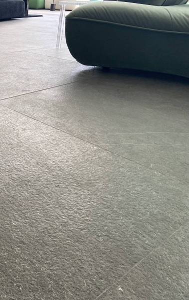Flooring with Natural stone slabs in giant format with brushed flame finish