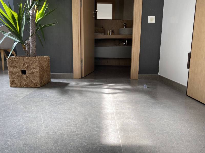 Majestic interior flooring in a villa in Casablanca, Morocco: opt for large slabs in brushed gray limestone natural stone from Morocco
