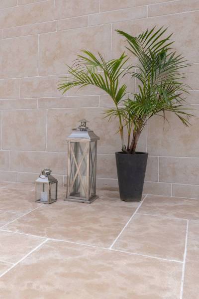 Natural stone paving in rustic aged Chablis beige limestone Ussé or Montpoupon finish opus Versailles format or free lenghts for outdoor terrace in Bristol England