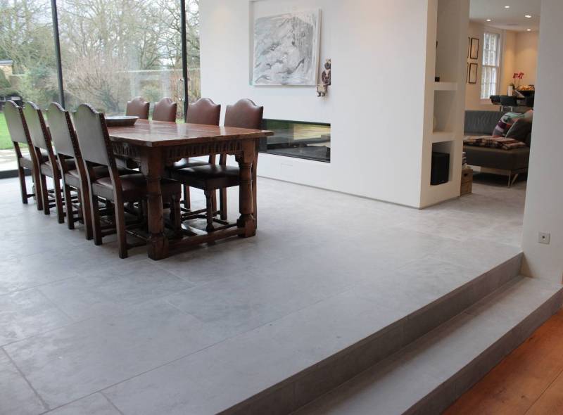 Beautiful aged stone as floor cladding material in big slabs for Montreal house's living and dining room. Affordable price in Montreal, Canada