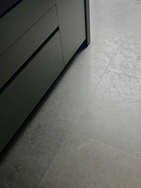 Bar in natural brushed limestone at the center of living space condo in La Jolla, San Diego, California, best price guaranteed